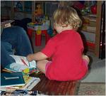 Laurel reading on table